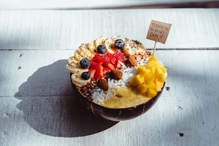 Delicious breakfast bowl with fruits and nuts, perfect for a healthy start.